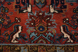 A close-up of the dense wool pile showing the Herati motif and geometric border detail.