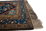 Vintage Ardebil runner corner, navy ground with perched birds and natural fringe.
