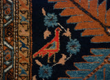 Hand knotted Ardebil runner with a vibrant red perched bird and sky blue floral motif.