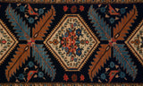 Intricate ivory floral medallion, blue serrated leaves, and perched bird on vintage Ardebil rug.