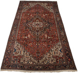 Full length view of a grand-scale vintage Mehrivan carpet with a red field and concentric medallion.