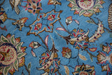 Intricate floral palmettes and bird motifs on the tight, sky blue kork wool pile of a vintage Qom rug.