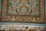 Intact white fringe and detailed border with floral vinery on a vintage Persian Tabriz rug.