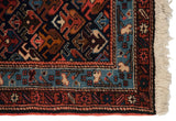Full pile and geometric floral border of a vintage hand knotted Ardebil rug runner.