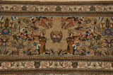 Symmetrical motif of kneeling archers and birds within a Persian Tabriz hunting scene.