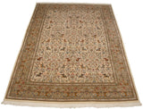 Vintage Persian Tabriz carpet with a pictorial hunting scene, shown in a full angled view.
