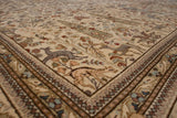 Angled view of a vintage Tabriz carpet corner showing pictorial animal and Cyprus tree motifs on a plush pile.