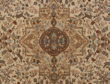 Geometric medallion on a vintage Tabriz carpet, surrounded by a pictorial field of animals and cypress trees.