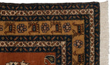 Vintage Meshkin carpet corner with original selvage, terracotta, navy geometric patterns and fringe.