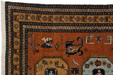 Vintage Meshkin carpet close-up: rust field with stylized animals, navy geometric borders, and white fringe.