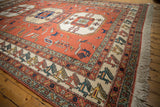 Terracotta and ivory border of vintage Persian Meshkin rug with repeating finned bird motifs.