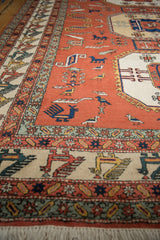 Vintage Persian Meshkin rug, terracotta field with stylized birds and geometric ivory finned bird border.