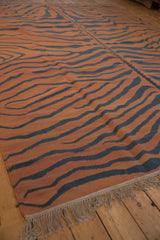 Hand woven Indian Tiger Kilim rug fringe, showcasing pale rust and dusty charcoal stripes.