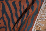 Vintage Indian kilim rug with rust and charcoal tiger stripe pattern, abrashes, and fringe.