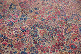 Phenomenally detailed millefleur motif with ruby, sapphire, and ivory tones on a Persian carpet.