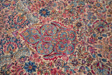 Close-up of a Lavar Kerman's detailed millefleur pattern and scrolling Rococo motifs.