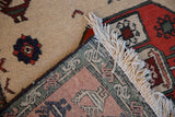 Vintage Meshkin rug detail showing hand-knotted foundation, original side cord, and ivory fringe.