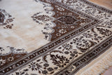 Angled view of the lush, full pile and detailed corner spandrel on a vintage Persian Tabriz.