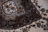 Full wool pile of a Tabriz rug with dense ornamentation in chocolate, silver, and ivory.