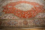 Ornate beige border detail of the vintage Tabatabaie Tabriz rug, with powder blue and multi-color florals.