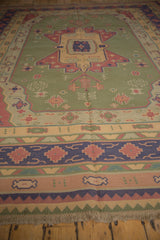 Original fringe and geometric border patterns in sand, red, blue on the hand-woven Dhurrie.