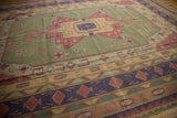 Geometric bands in navy blue, raspberry, and sand on a vintage Dhurrie carpet border.