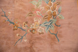 Plush pile and hand-knotted texture of an Art Deco floral motif in mint, gold, and sky blue.
