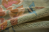 Plush, soft pile texture of the Japanese Art Deco rug, with seafoam green, dusty blush, and blue.