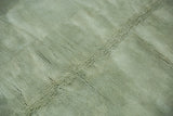 Plush, soft seafoam green pile showing diagonal textural variations of the Art Deco rug.