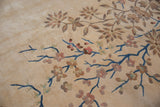 Ornate blue vines and blush, mint foliage on a plush Japanese Art Deco carpet.