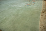 Plush pale ocean green pile and intact selvage fringe of Japanese Art Deco rug.