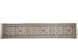 Vintage Persian Tabriz runner with an allover pattern of scrolling flora and fauna on an ivory field.