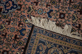 Detailed fringe and intricate indigo border with Herati motif on a vintage Ardebil carpet.