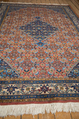 Fully secured fringe and intricate sapphire blue, wine red, beige border of the Ardebil rug.