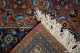 Vintage Ardebil rug corner with Herati motif, hand-knotted fringe, and terracotta selvage.