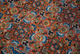 Vintage Ardebil carpet's detailed Herati motif with terra cotta, sky blue, and green tones.