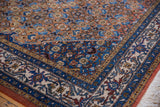 Intricate Herati motif and contrasting floral border in faded rust and denim blue.