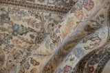 Intricate allover forest design on the plush pile of a folded vintage Tabriz runner.