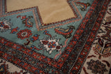 Vintage Persian Meshkin carpet, showing corner of deep ocean green geometric pattern.