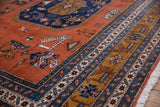 Vintage Ardebil hand-knotted carpet with pale rust field, playful animal figures, geometric borders, and fringe.