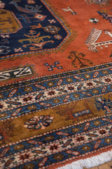 Hand-knotted Vintage Ardebil carpet border with ivory, navy, bronze patterns and white fringe.