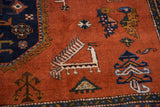 Vintage Ardebil rug's pale rust field with playful geometric bird and animal motifs.
