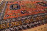 Vintage Ardebil rug's geometric border detail in navy, bronze, ivory, and terracotta.