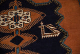 Finned medallion and bird motifs on navy field with geometric border of vintage Meshkin rug.