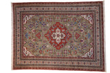 Vintage Ardebil carpet, moss green field, rust central medallion, palmette finials, geometric motifs.