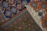 Clean fringe and original side cord selvage of a vintage Ardebil rug with geometric pattern.