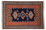 Vintage Ardebil carpet with navy blue finned medallions, dusty sandalwood field, geometric borders, 7'6