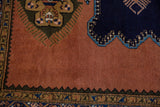 Dusty sandalwood field meets serrated olive green detail on a vintage Ardebil carpet.