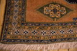 Vintage Ardebil rug corner, full pile, ivory fringe, geometric borders, and olive finned motif.