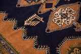 Hand-knotted Vintage Ardebil rug detail: deep navy field with crisp sandalwood finned contour.